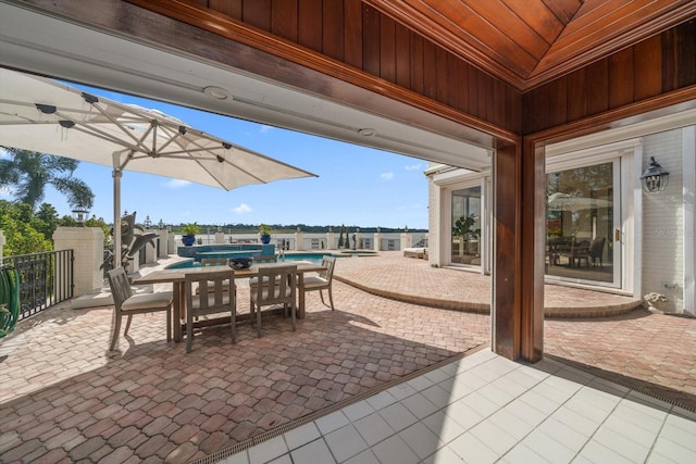 view of patio / terrace with fence and a fenced in pool