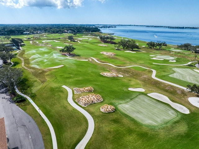 aerial view featuring a water view and view of golf course