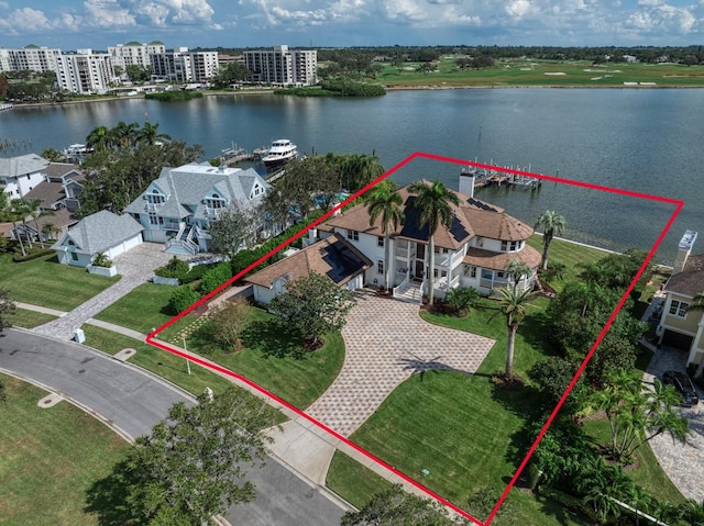 birds eye view of property with a water view