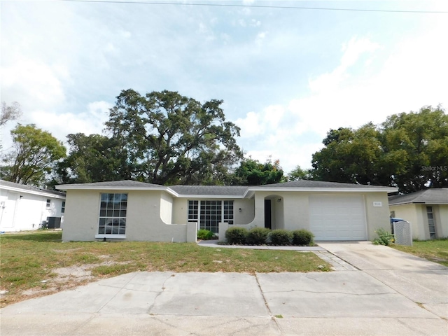 ranch-style house with a front yard and a garage