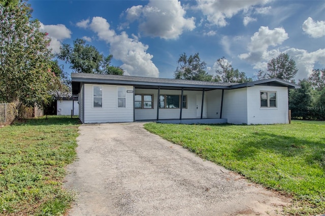 single story home with a front yard and a porch