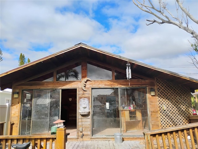 rear view of property with a deck