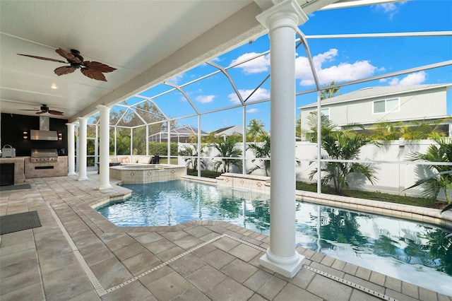 view of pool featuring an in ground hot tub, an outdoor kitchen, area for grilling, and a patio