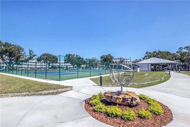 surrounding community with tennis court