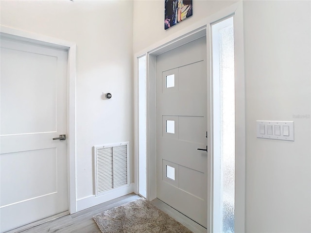 entrance foyer with light hardwood / wood-style floors