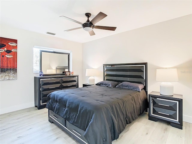 bedroom featuring light hardwood / wood-style floors and ceiling fan