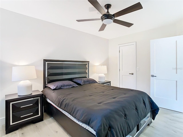 bedroom featuring light hardwood / wood-style flooring and ceiling fan