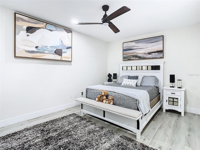 bedroom with hardwood / wood-style flooring and ceiling fan