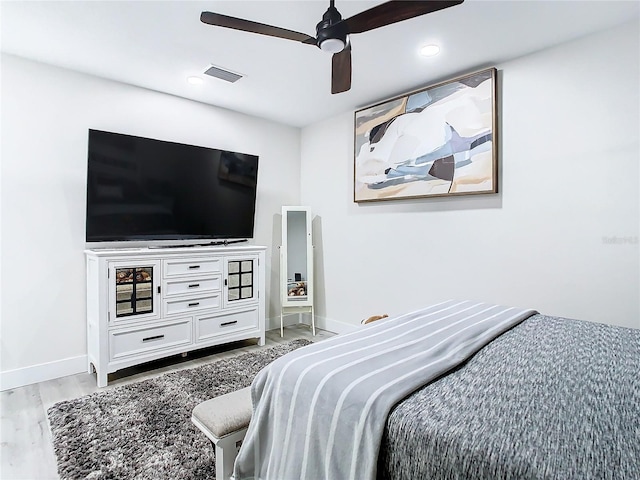 bedroom featuring light hardwood / wood-style floors and ceiling fan