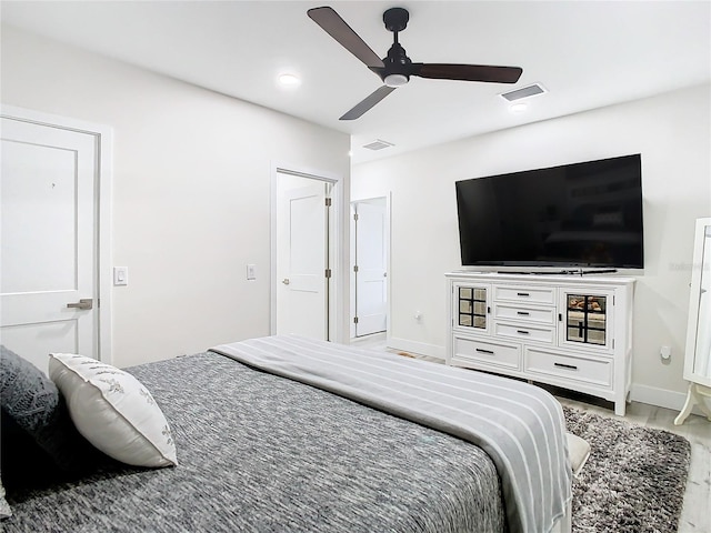 bedroom featuring ceiling fan and wood-type flooring