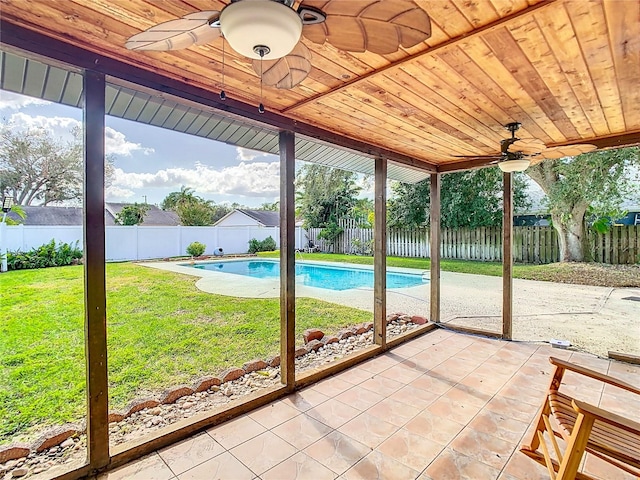 unfurnished sunroom with wooden ceiling and ceiling fan