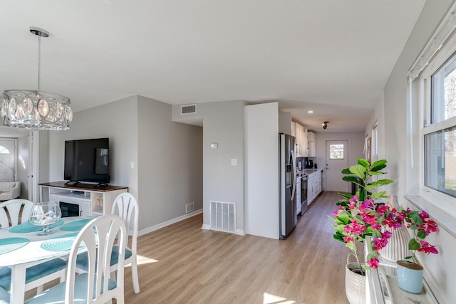 dining area with light hardwood / wood-style flooring