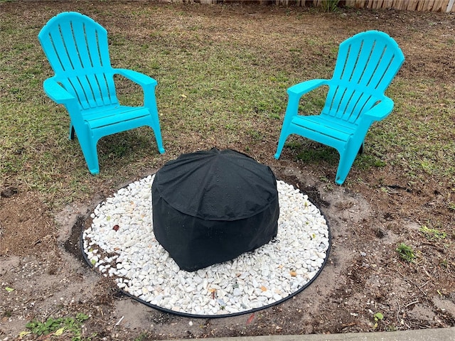 view of yard with an outdoor fire pit