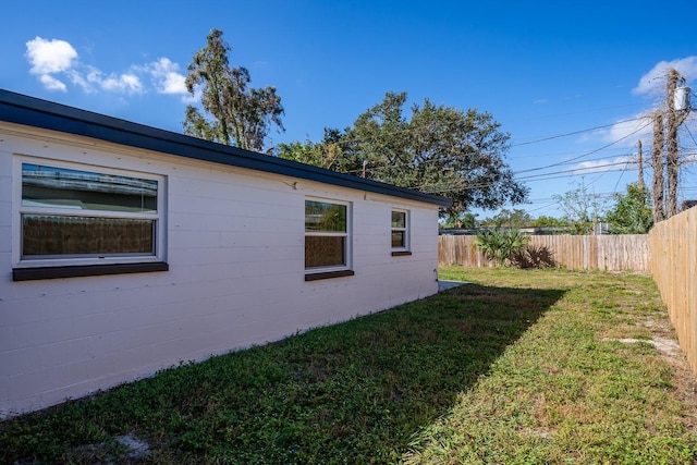 view of home's exterior with a yard