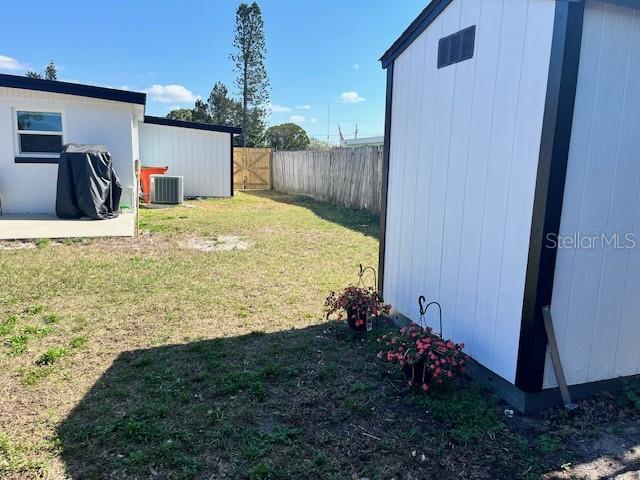 view of yard featuring central AC unit