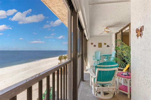 balcony with a view of the beach and a water view