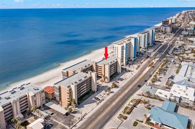 bird's eye view featuring a water view and a view of the beach