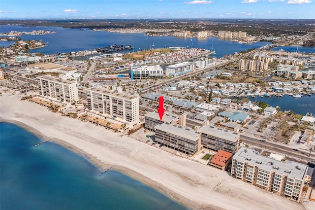 bird's eye view with a water view and a view of the beach