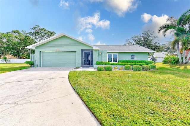 ranch-style house featuring a front lawn and a garage