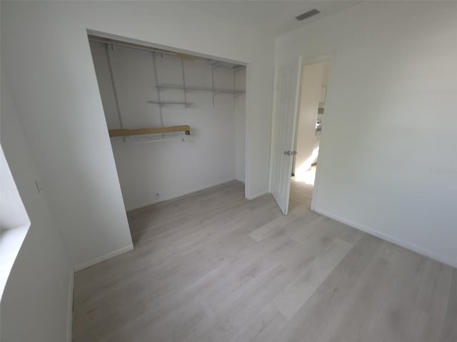 3102 W Leroy St Unit A, Tampa, FL 33607 - unfurnished bedroom featuring light wood-style flooring and a closet