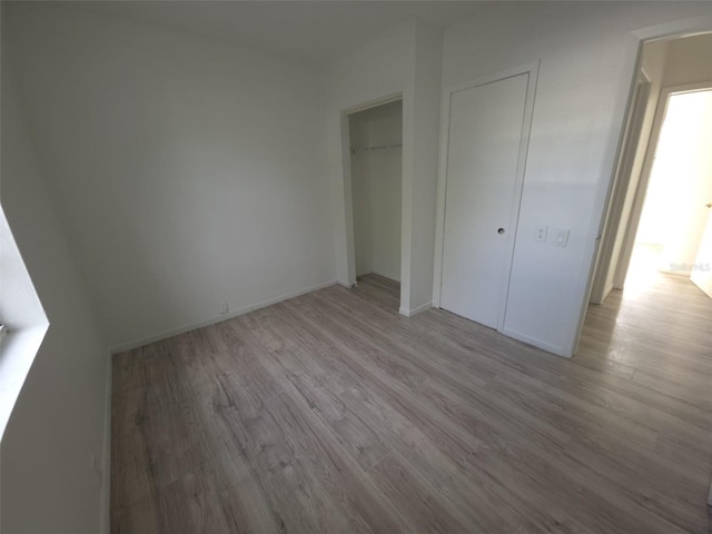 3102 W Leroy St Unit A, Tampa, FL 33607 - unfurnished bedroom featuring light wood finished floors and a closet