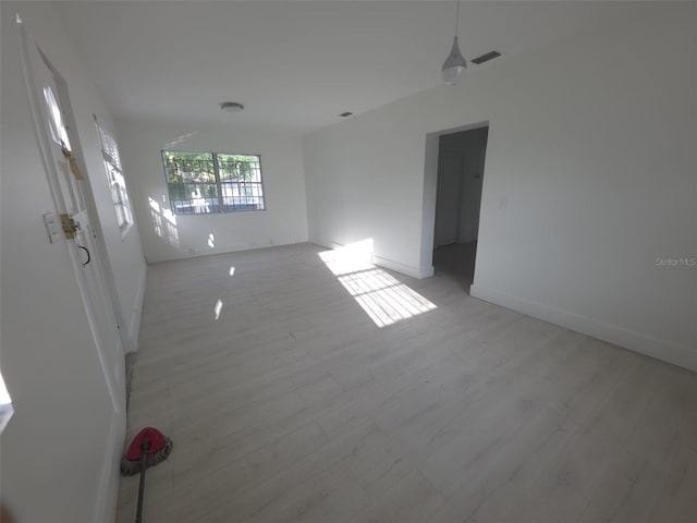 3102 W Leroy St Unit A, Tampa, FL 33607 - unfurnished room featuring light wood-type flooring and baseboards