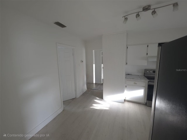 3102 W Leroy St Unit A, Tampa, FL 33607 - spare room with light wood-style floors and baseboards