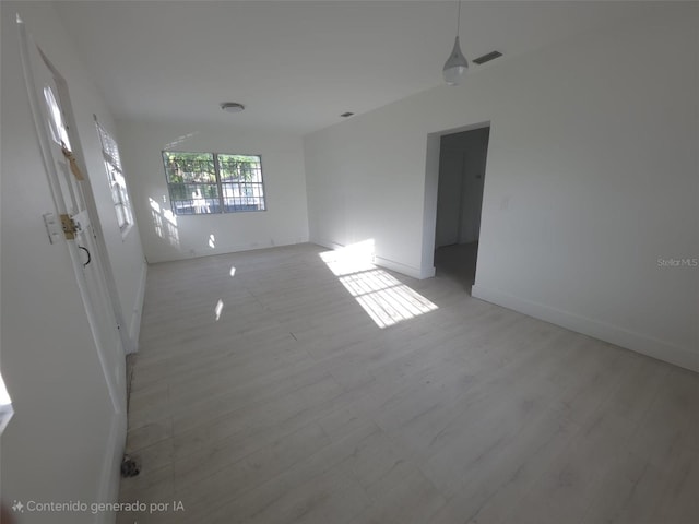 3102 W Leroy St Unit A, Tampa, FL 33607 - unfurnished room with baseboards and light wood-type flooring