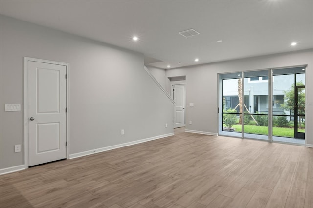 spare room featuring light hardwood / wood-style flooring