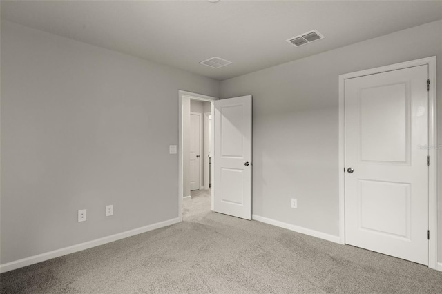 unfurnished bedroom with light carpet