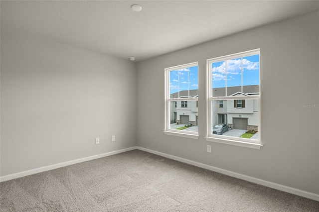 unfurnished room with carpet