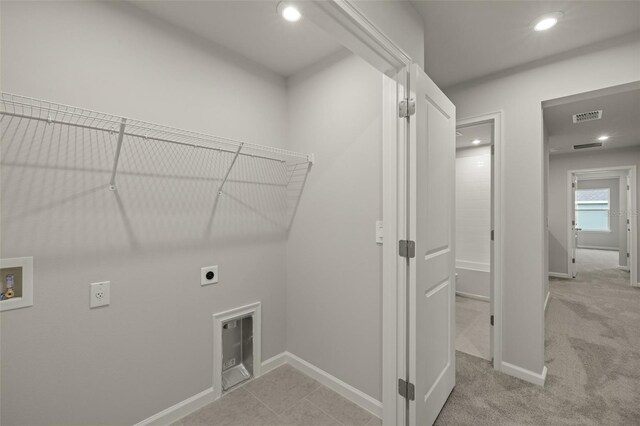 laundry room with hookup for a washing machine, light carpet, and electric dryer hookup