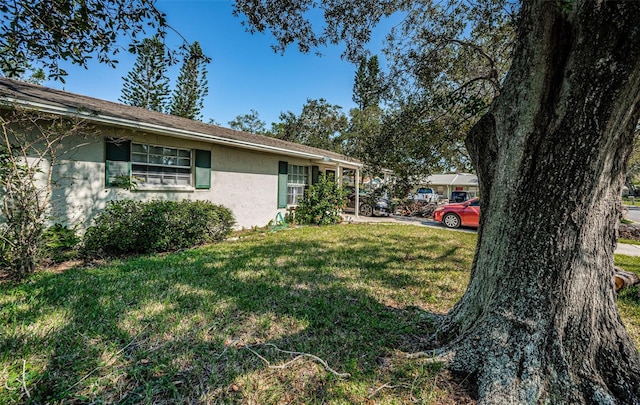 view of side of home featuring a yard