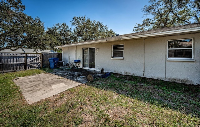 rear view of house with a patio