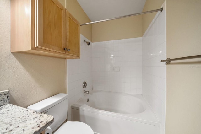 full bathroom with vanity, washtub / shower combination, and toilet