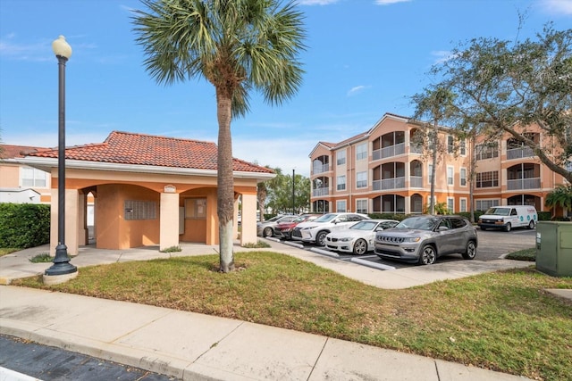 5000 Culbreath Key Way Unit 1-203, Tampa, FL 33611 - view of building exterior featuring uncovered parking