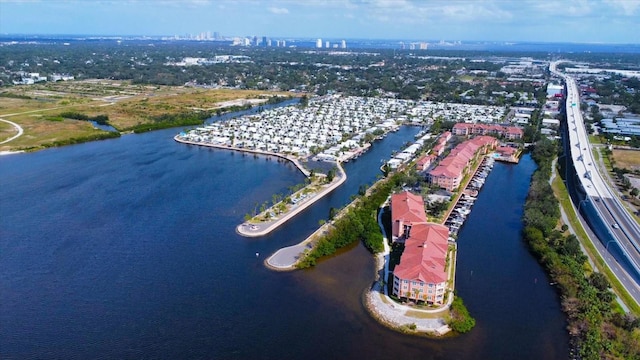 birds eye view of property featuring a water view