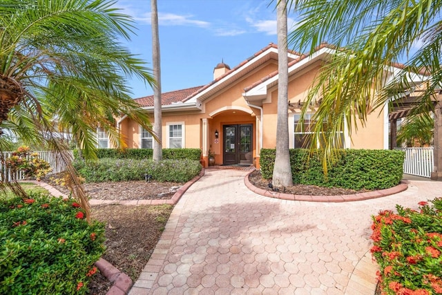 entrance to property featuring french doors