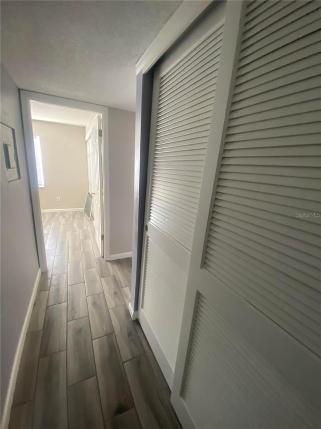 hallway featuring hardwood / wood-style floors