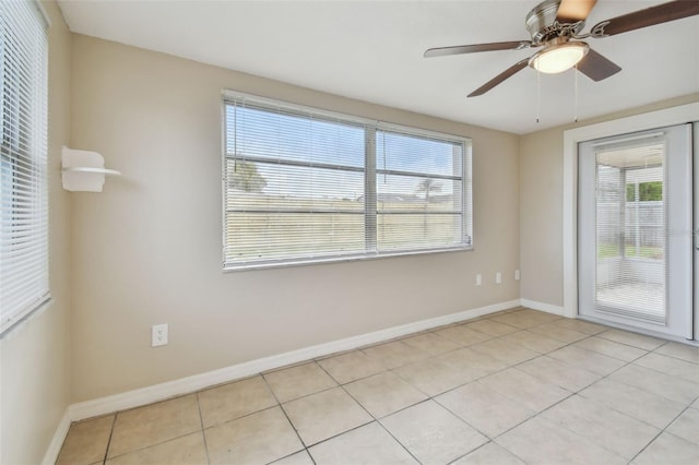 tiled empty room with ceiling fan