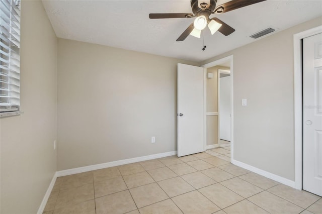 interior space featuring ceiling fan