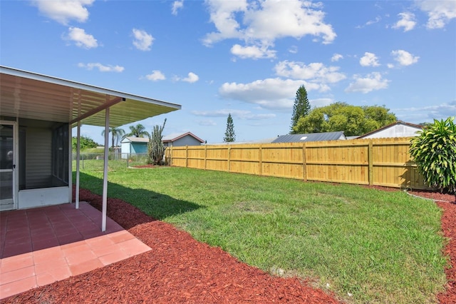 view of yard with a patio area and a sunroom