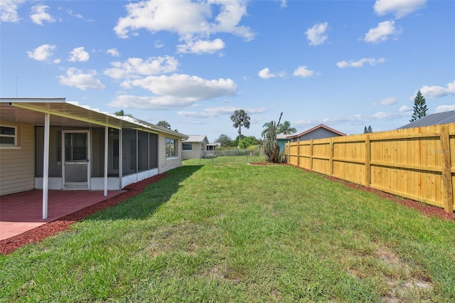 view of yard with a patio area and a sunroom