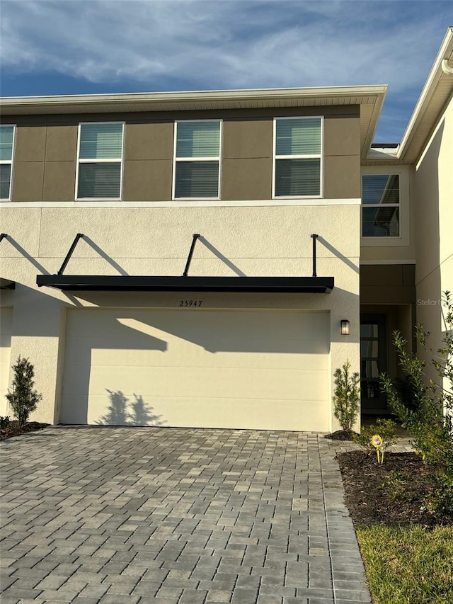 view of front of property with a garage