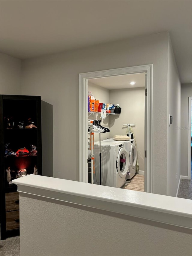 washroom featuring light colored carpet and washing machine and dryer