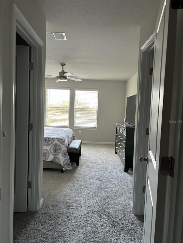 bedroom with ceiling fan and carpet floors