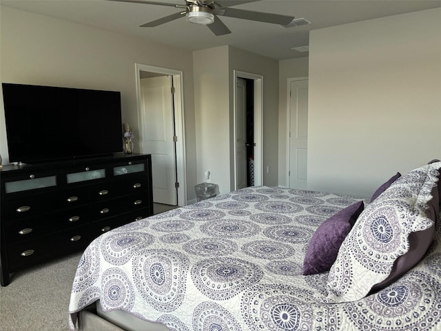 bedroom with light carpet and ceiling fan