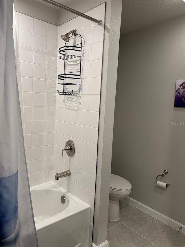 bathroom featuring shower / bath combo, toilet, and tile patterned flooring