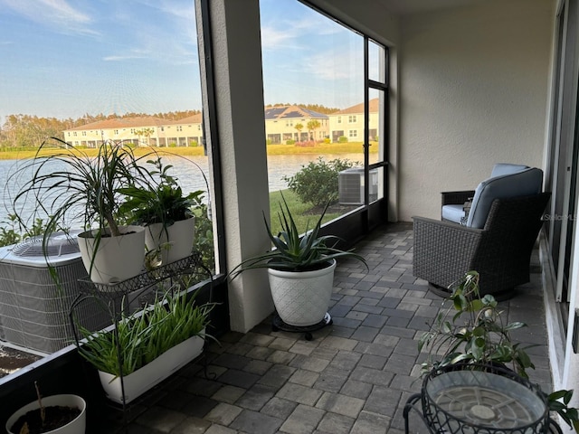 sunroom with a water view