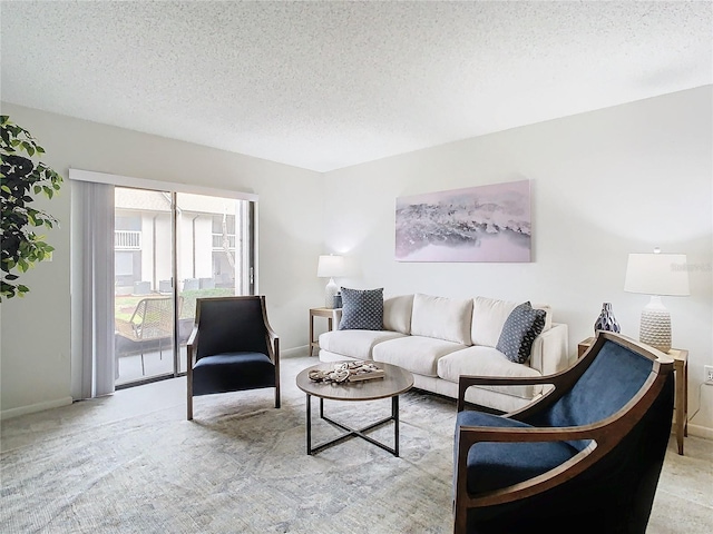 living room with light colored carpet and a textured ceiling